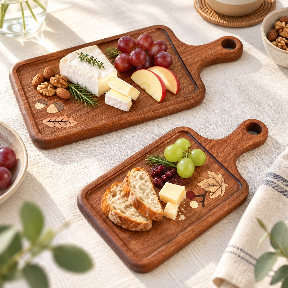 Wooden serving boards styled with cheese, fruit and bread